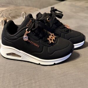 Skechers Little Girl’s Black and White Sneakers with Gold Accents